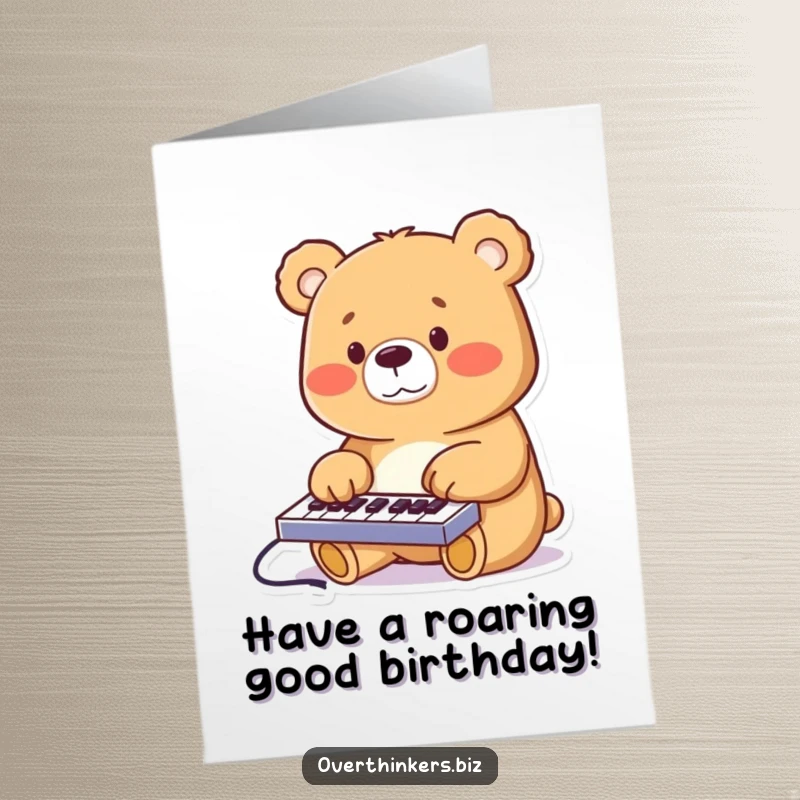Funny Free Printable Birthday Card: A cheerful bear enthusiastically types on a tiny keyboard, celebrating with paws flying.