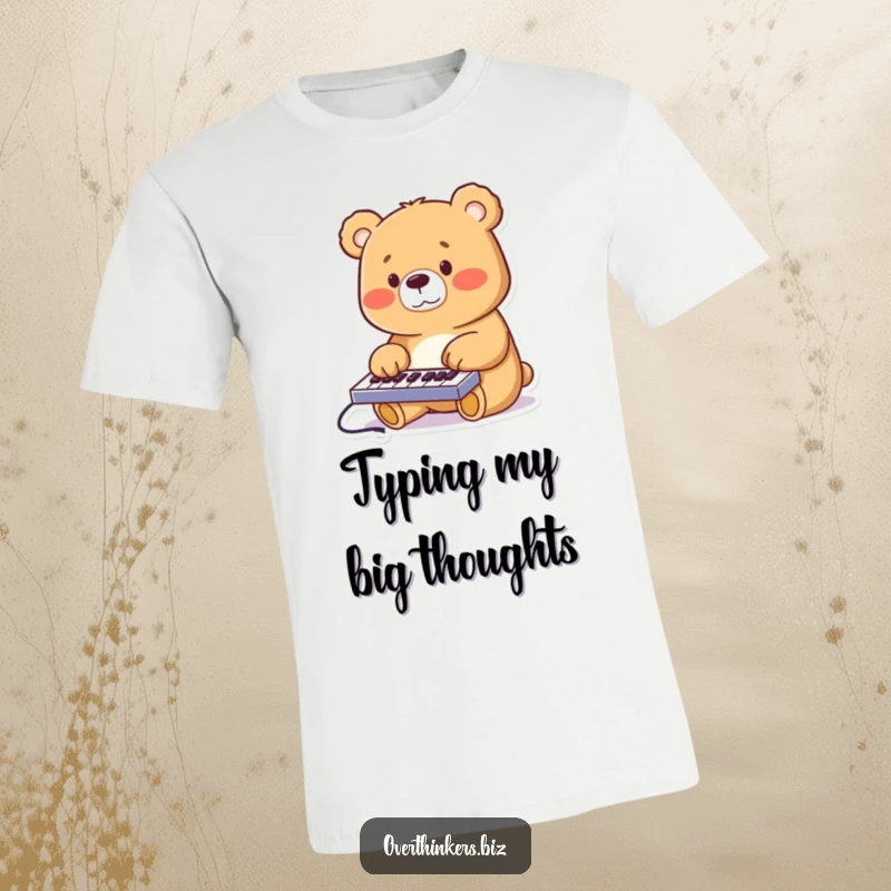 Funny cheerful bear furiously typing on a miniature keyboard with its paws, printed on a comfortable graphic t-shirt.